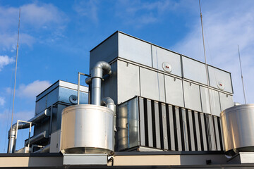 Central unit of the ventilation and air conditioning system on the roof of the building. The photo...