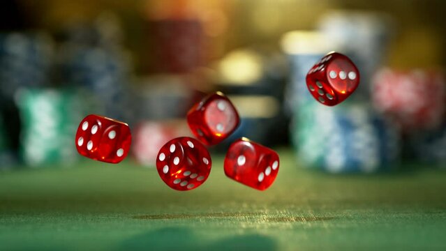 Super slow motion of rolling gaming dices on poker table. Filmed on high speed cinema camera, 1000fps.