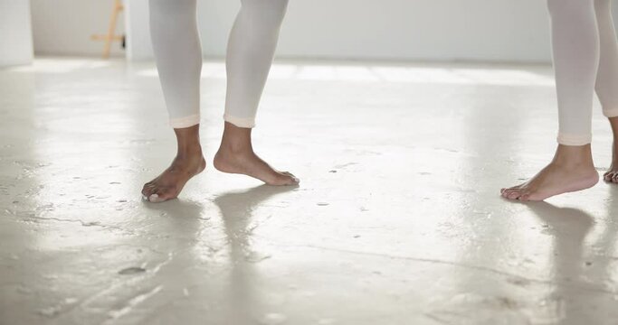 Dancing, performance and feet of people in a creative art studio with energy and passion. Barefoot contemporary dancer duo practice for theater, sports and freedom with balance, exercise and talent