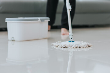 young woman holding cleaning supplies Close-up shot of girl wearing gloves cleaning the area of the house or office. cleaning concept