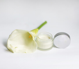Cream in a jar on a white background