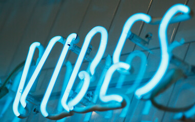 Neon sign good vibes only on a dark background