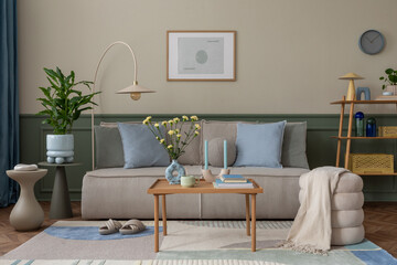 Interior design of warm and cozy living room with mock up poster frame, modular sofa, blue pillows,...