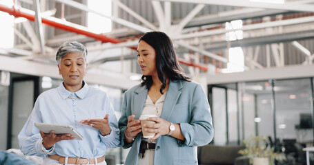 Mentor, tablet and senior woman with employee, talking and walking in office for online research....