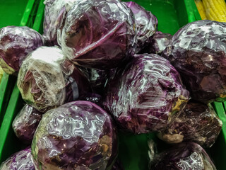 Fototapeta na wymiar Red cabbage isolated on green