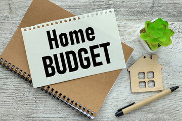 Home budget. notepad on a wooden table. text on the page