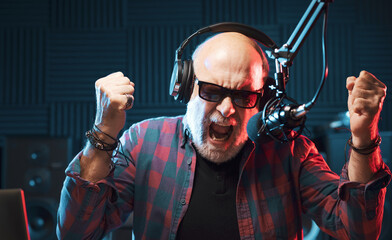 Aggressive DJ talking into the microphone