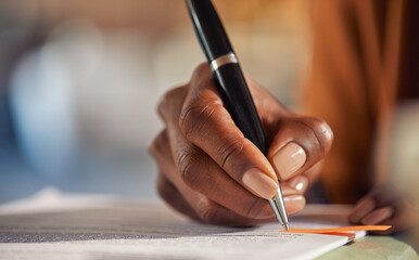 Close up of black woman hand writing on business document - 642089064