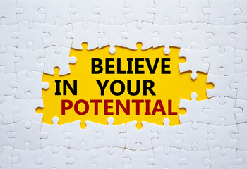 Potential symbol. Concept word Believe in your Potential on white puzzle. Beautiful yellow...