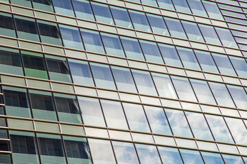 Window office building in Tokyo city against blue sky with cloud