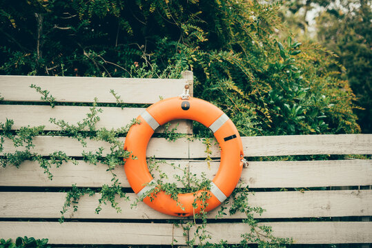 A life ring on a fence