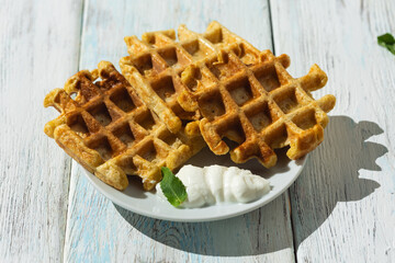 Breakfast on the table Viennese waffles, tea with lemon,