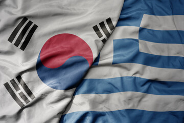 big waving national colorful flag of south korea and national flag of greece .