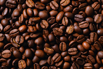 Obraz premium Background of roasted fresh brown coffee beans, perfect for a cool wallpaper