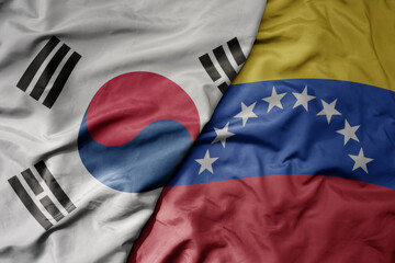 big waving national colorful flag of south korea and national flag of venezuela .