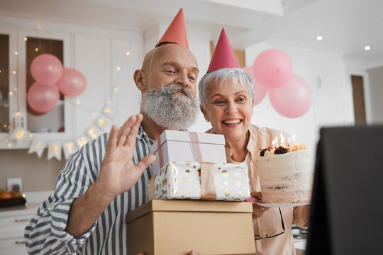 Birthday party, video call and senior couple celebrate online with cake for remote event and connection on tablet. Internet, web and elderly people excited for gift or virtual surprise together - Powered by Adobe