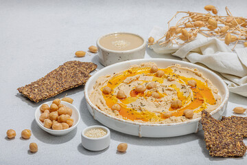 Hummus with olive oil, crispy bread. Indispensable for healthy lifestyle. Comfort food, vegan snack