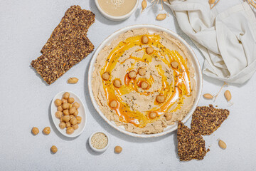 Hummus with olive oil, crispy bread. Indispensable for healthy lifestyle. Comfort food, vegan snack