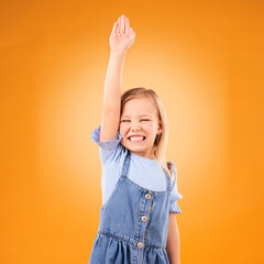 Learning, hands raised and happy kid with question in studio isolated on an orange background mockup space. Excited, answer and girl student asking why, knowledge and education at kindergarten school