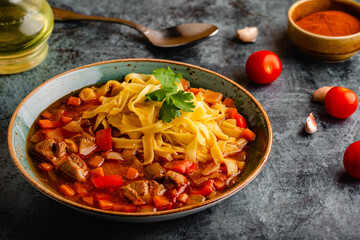 Lagman soup with lamb, homemade noodles and vegetables.