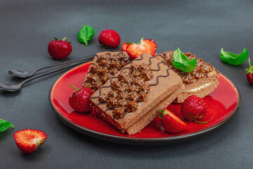 Delicious chocolate cakes with fresh strawberries. Sweet dessert, good morning concept
