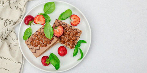 Delicious chocolate cakes with fresh strawberries. Sweet dessert, good morning concept