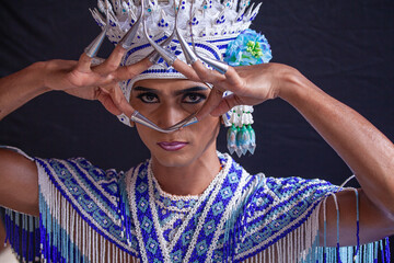 Nora performer performs temple dance moves..The Nora is a traditional dance of Southern in Thailand. Beautiful jewelry with bright colors..Delicate and powerful dance moves.