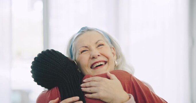 Surprise, senior woman and caregiver hug with love, support and happiness on face in nursing home, house or living room. Happy, embrace and portrait of elderly lady with care, kindness and empathy