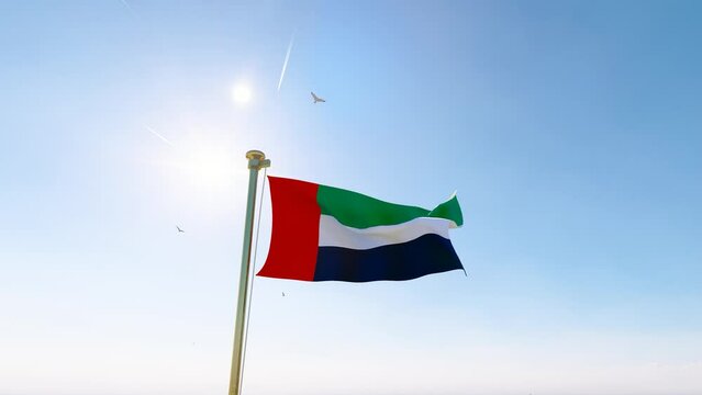 Flag of the United Arab Emirates. Flag of United Arab Emirates waving in the wind, sky and sun background. Dubai Flag Video. Realistic Animation, 4K UHD. 