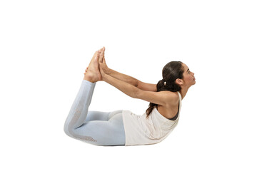 Obraz premium Woman doing yoga, Dhanurasana or Bow Pose