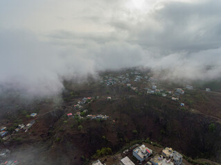 Aerial photos of Assomada in Santiago Island, Cabo Verde, reveal the vibrant culture, colorful markets, and stunning mountain landscapes of this historic town. The bird's-eye view captures the essence