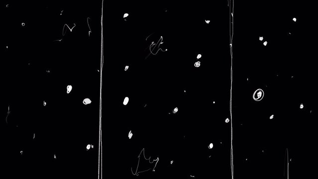 Old film strip with white dots od damage and erasure on black screen. Stock retro effect for overlaying nostalgic mood in 4K with alpha channel.