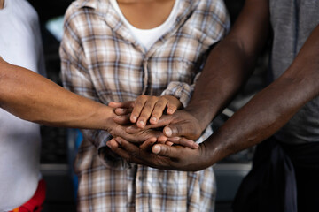 workers joining hands for cooperation success work and project in the factory