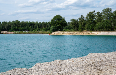 Fototapeta premium Panoramic view over the sand beaches and blue water of the lake in Weert, The Netherlands