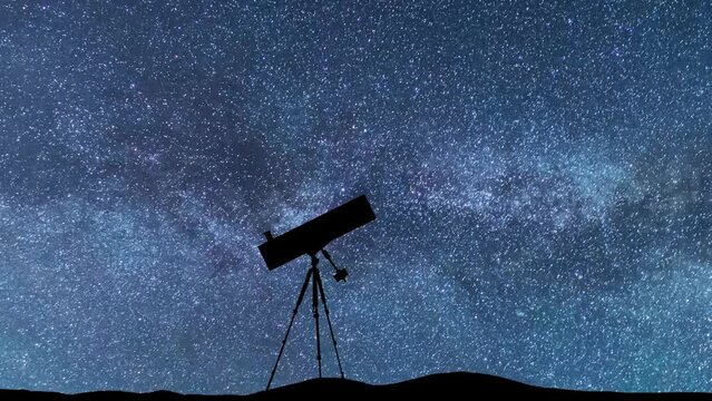 Silhouette of a telescope in the starry night.