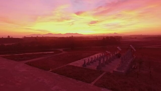 aerial view Imagine a fantasy colorful sky at sunrise above Buddha statues..scenery sunrise above the place of religious activities there have a lot of Buddha statues. .colorful sky background