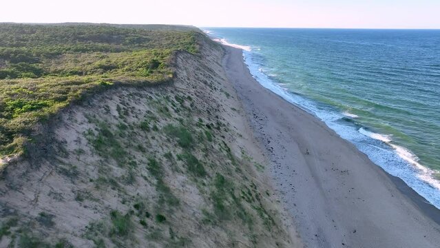 Passing over sand dunes and Cahoon Beach on the Atlantic Ocean at Cape Cod.