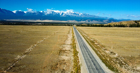 Aerial view of mountain road. Active tourists place in Altai region, Chui tract. Asphalt road in mountains.