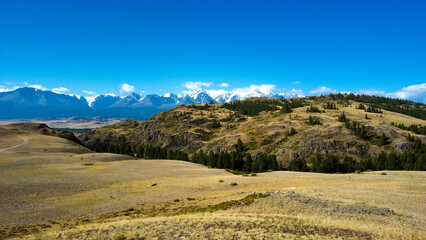 Aerial view of mountain road. Active tourists place in Altai region, Chui tract. Asphalt road in mountains.