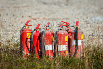 Red tank of fire extinguisher. Overview of a powerful industrial fire extinguishing system....