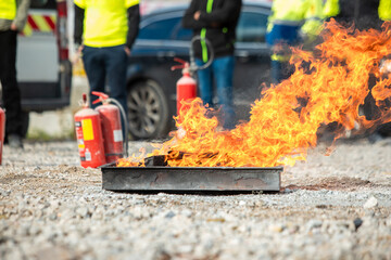 Fire flame in steel bucket for demonstrate to extinguish fire