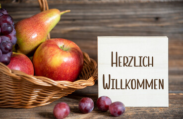 Fall Decoration with Fruits and Text Herzlich Willkommen