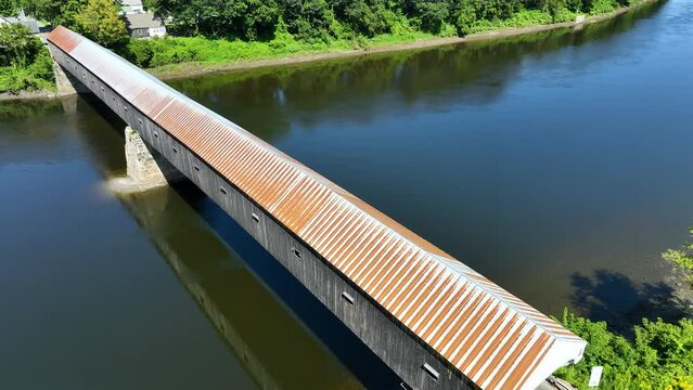Passing over the Cornish Windsor covered bridge spanning the Connecticut River.