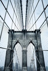 A minimalist pop art representation of the iconic Brooklyn Bridge in New York City, highlighting...