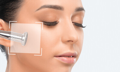 Cosmetologist makes  procedure microdermabrasion on the face against acne and blackheads. Women's...