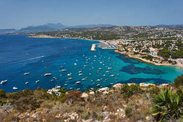 Moraira view from cap d'or with many boats