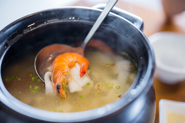 Seafood rice vermicelli soup bowl in restaurant