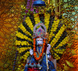 hanuman sculpture beautiful decorated with flowers and cloth in temple