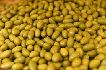 Green ripe olives close-up. Background of olives