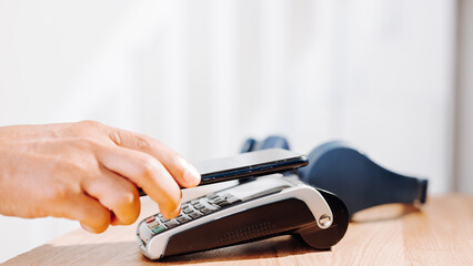 NFC payment with mobile phone in electronic store